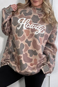 Camouflage-patterned sweatshirt with 'Howdy' text worn by a person against a white background