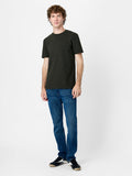 A man wearing a dark green T-Shirt with short sleeves, a crew neckline and a regular fit.