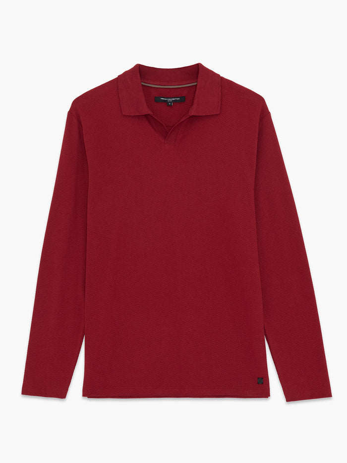 A red popcorn textured Polo shirt with long sleeves, a trophy collar and a regular fit.